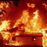 California’s largest fire burns homes as blazes scorch US West